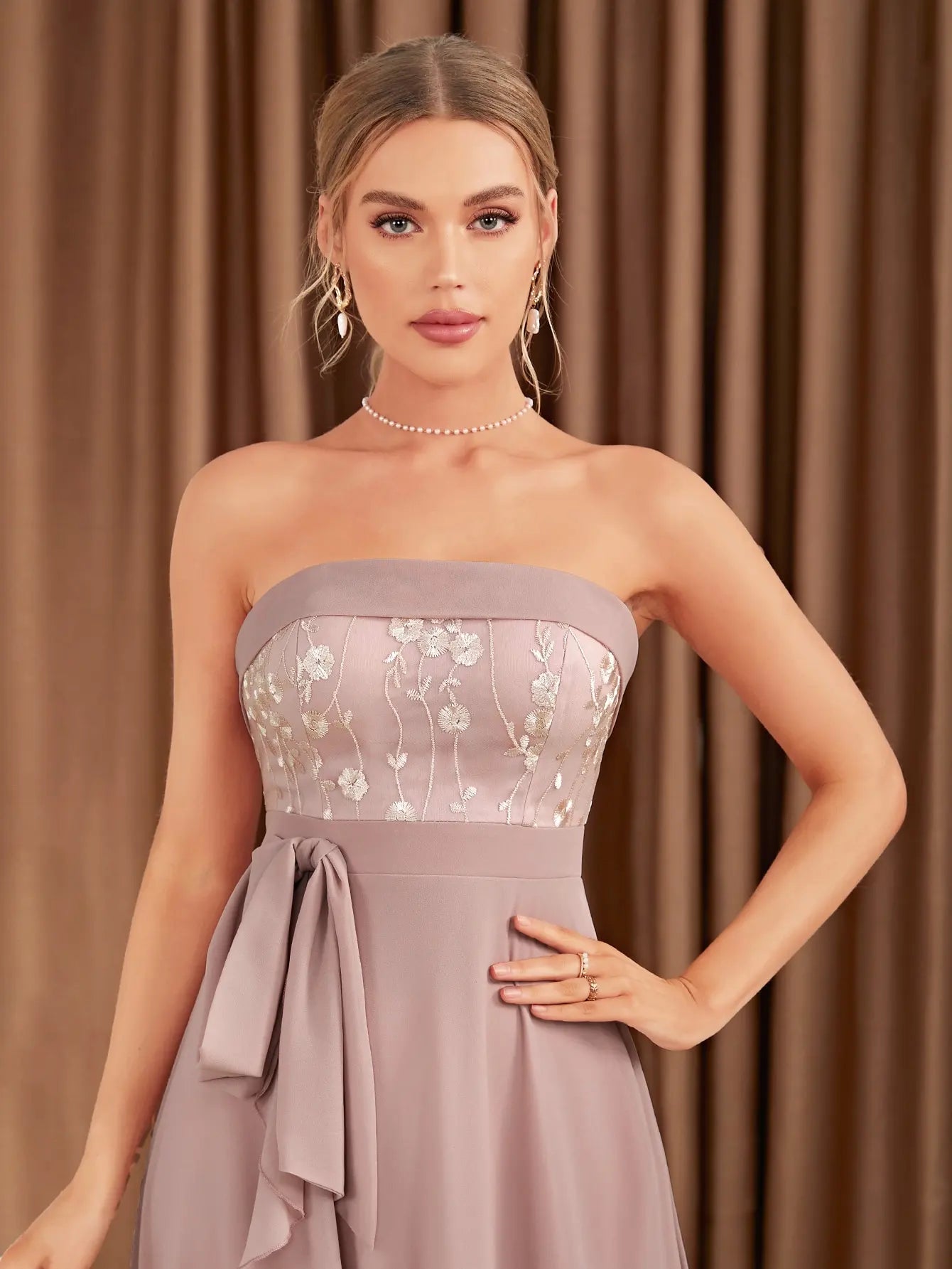 The adult formal dress is wrapped around the chest and decorated with a belt on the back